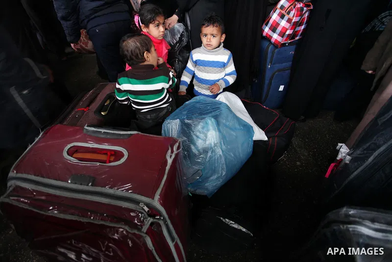 Palestinians wait for travel permits to cross into Egypt through the Rafah border crossing after it was opened by Egyptian authorities for humanitarian cases, in Rafah in the southern Gaza Strip January 28, 2017. Photo b...
