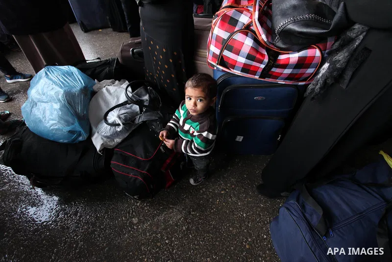 Palestinians wait for travel permits to cross into Egypt through the Rafah border crossing after it was opened by Egyptian authorities for humanitarian cases, in Rafah in the southern Gaza Strip January 28, 2017. Photo b...
