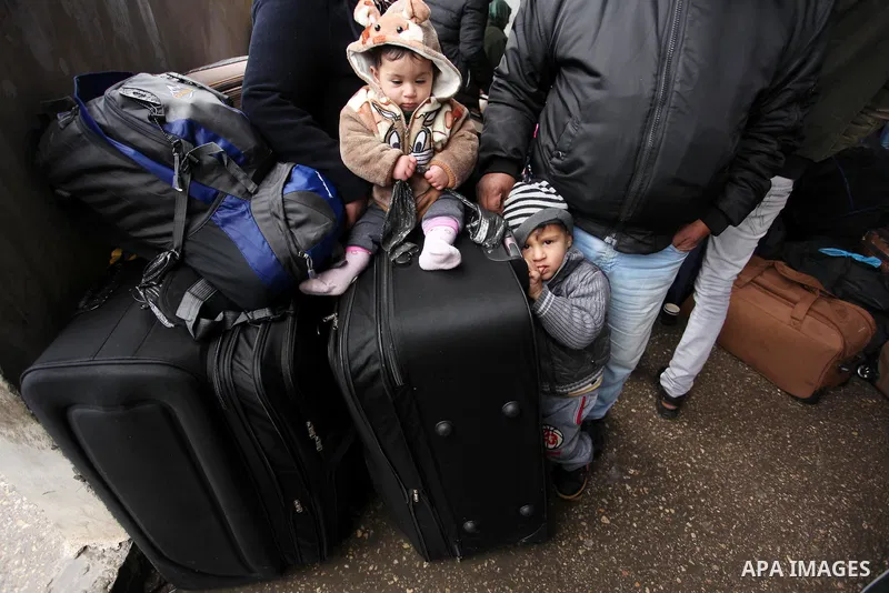 Palestinians wait for travel permits to cross into Egypt through the Rafah border crossing after it was opened by Egyptian authorities for humanitarian cases, in Rafah in the southern Gaza Strip January 28, 2017. Photo b...