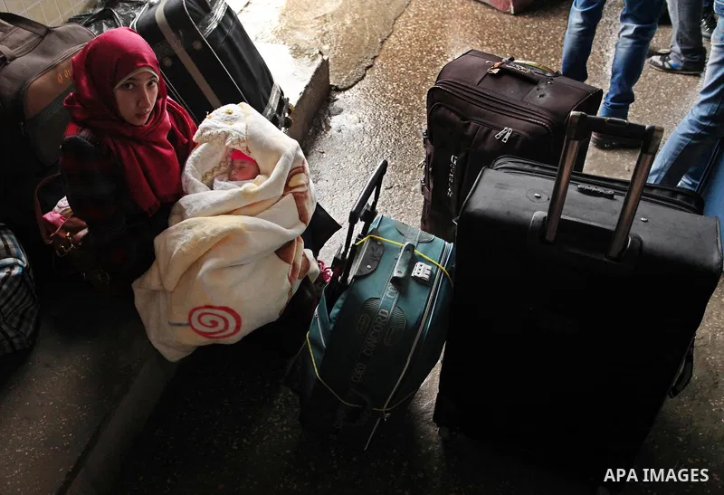 Palestinians wait for travel permits to cross into Egypt through the Rafah border crossing after it was opened by Egyptian authorities for humanitarian cases, in Rafah in the southern Gaza Strip January 28, 2017. Photo b...
