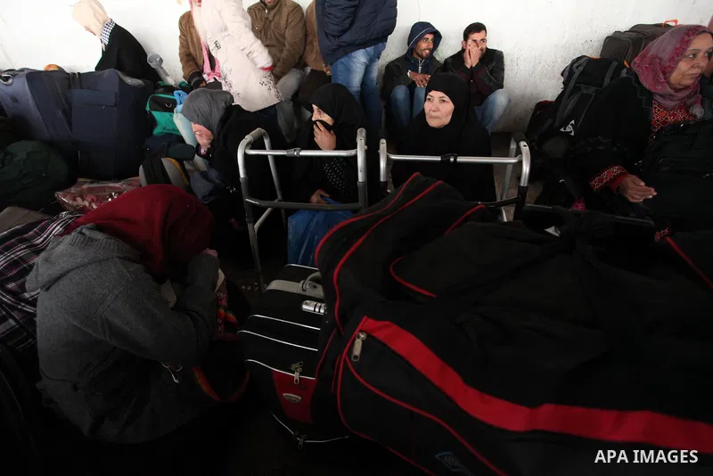 Palestinians wait for travel permits to cross into Egypt through the Rafah border crossing after it was opened by Egyptian authorities for humanitarian cases, in Rafah in the southern Gaza Strip January 28, 2017. Photo b...