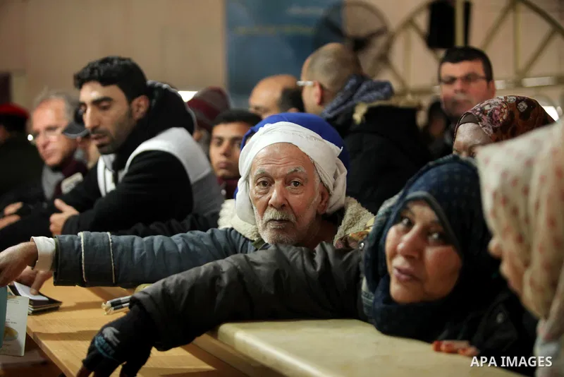 Palestinians wait for travel permits to cross into Egypt through the Rafah border crossing after it was opened by Egyptian authorities for humanitarian cases, in Rafah in the southern Gaza Strip January 28, 2017. Photo b...