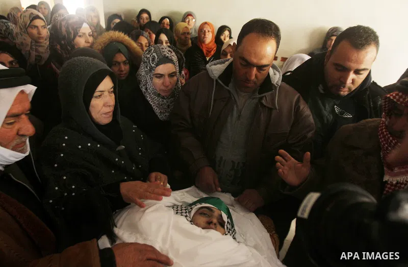 Relatives of Majd al-Khudur, a Palestinian woman who was killed by Israeli security forces during a car-ramming attack last year, mourns during her funeral in the West Bank village of Bani Naim near Hebron on January 28,...