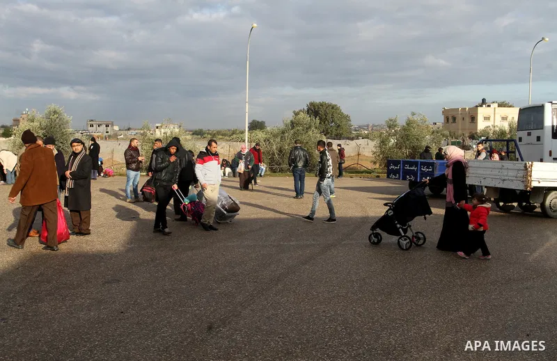 Palestinians wait for travel permits to cross into Egypt through the Rafah border crossing after it was opened by Egyptian authorities for humanitarian cases, in Rafah in the southern Gaza Strip, on January 29, 2017. Pho...