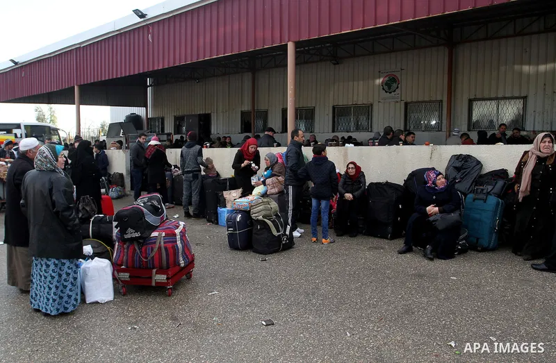 Palestinians wait for travel permits to cross into Egypt through the Rafah border crossing after it was opened by Egyptian authorities for humanitarian cases, in Rafah in the southern Gaza Strip, on January 29, 2017. Pho...