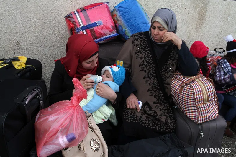 Palestinians wait for travel permits to cross into Egypt through the Rafah border crossing after it was opened by Egyptian authorities for humanitarian cases, in Rafah in the southern Gaza Strip, on January 29, 2017. Pho...