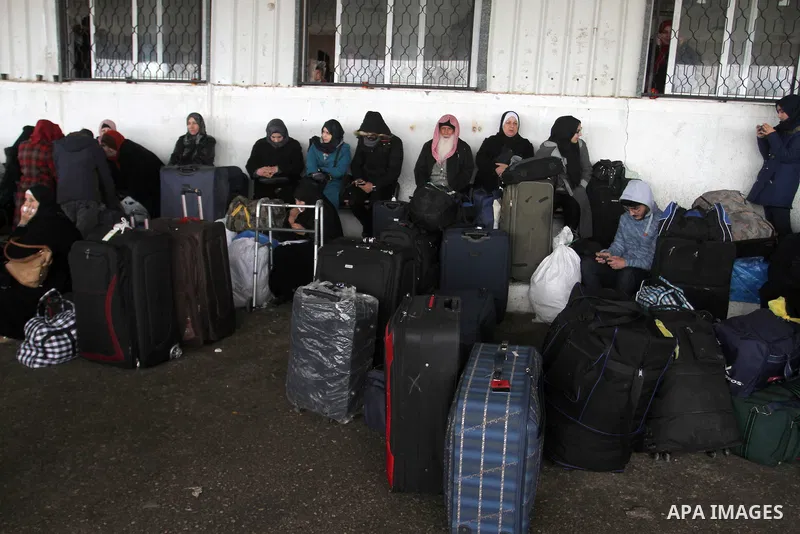 Palestinians wait for travel permits to cross into Egypt through the Rafah border crossing after it was opened by Egyptian authorities for humanitarian cases, in Rafah in the southern Gaza Strip, on January 29, 2017. Pho...