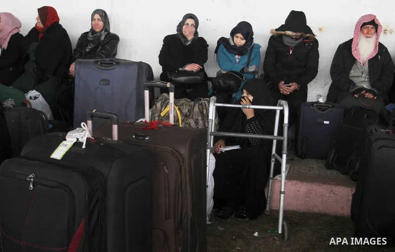 Palestinians wait for travel permits to cross into Egypt through the Rafah border crossing after it was opened by Egyptian authorities for humanitarian cases, in Rafah in the southern Gaza Strip, on January 29, 2017. Pho...