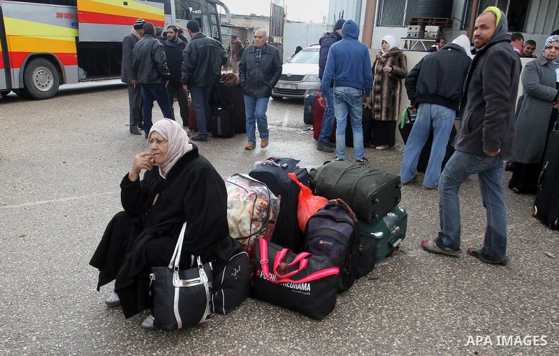 Palestinians wait for travel permits to cross into Egypt through the Rafah border crossing after it was opened by Egyptian authorities for humanitarian cases, in Rafah in the southern Gaza Strip, on January 29, 2017. Pho...