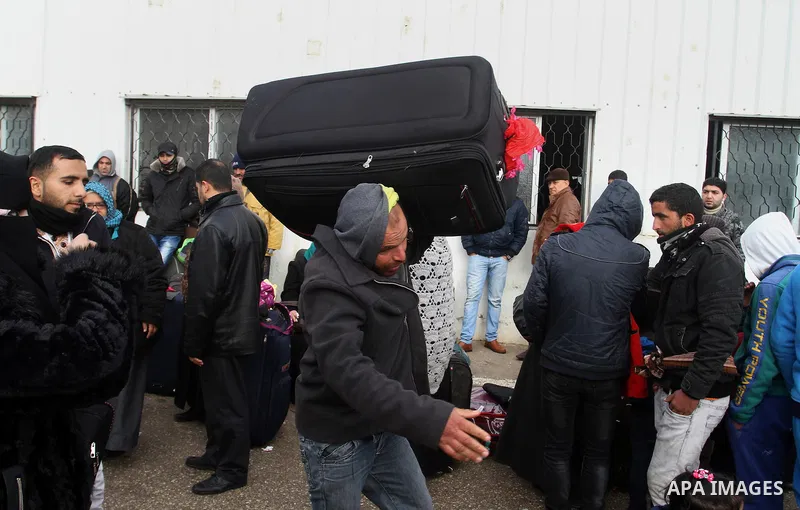 Palestinians wait for travel permits to cross into Egypt through the Rafah border crossing after it was opened by Egyptian authorities for humanitarian cases, in Rafah in the southern Gaza Strip, on January 29, 2017. Pho...