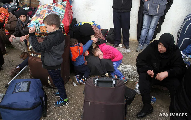 Palestinians wait for travel permits to cross into Egypt through the Rafah border crossing after it was opened by Egyptian authorities for humanitarian cases, in Rafah in the southern Gaza Strip, on January 29, 2017. Pho...