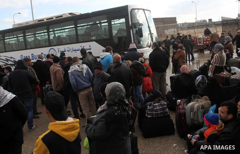 Palestinians wait for travel permits to cross into Egypt through the Rafah border crossing after it was opened by Egyptian authorities for humanitarian cases, in Rafah in the southern Gaza Strip, on January 29, 2017. Pho...