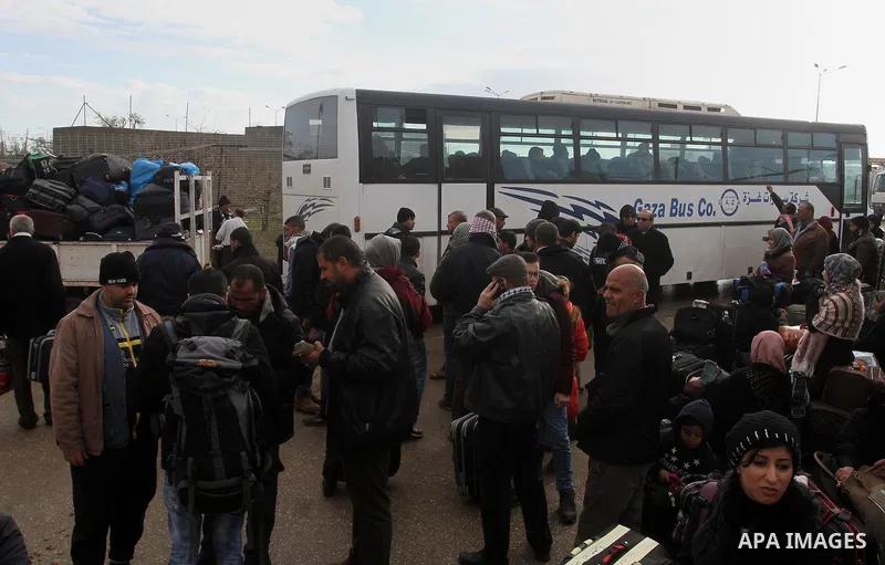 Palestinians wait for travel permits to cross into Egypt through the Rafah border crossing after it was opened by Egyptian authorities for humanitarian cases, in Rafah in the southern Gaza Strip, on January 29, 2017. Pho...