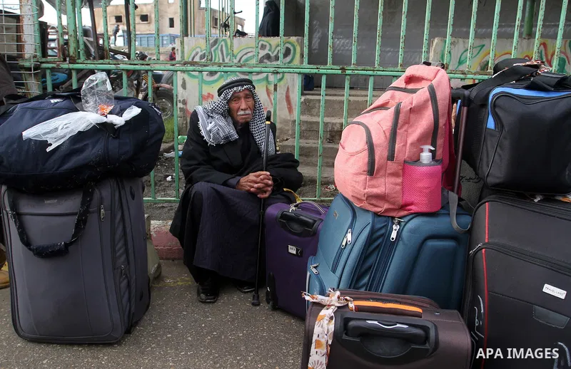 Palestinians wait for travel permits to cross into Egypt through the Rafah border crossing after it was opened by Egyptian authorities for humanitarian cases, in Rafah in the southern Gaza Strip, on January 29, 2017. Pho...