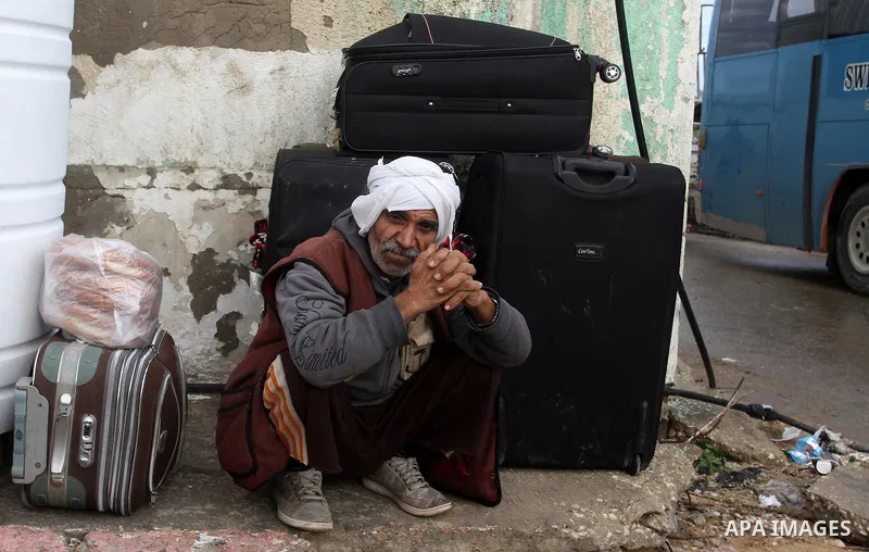 Palestinians wait for travel permits to cross into Egypt through the Rafah border crossing after it was opened by Egyptian authorities for humanitarian cases, in Rafah in the southern Gaza Strip, on January 29, 2017. Pho...