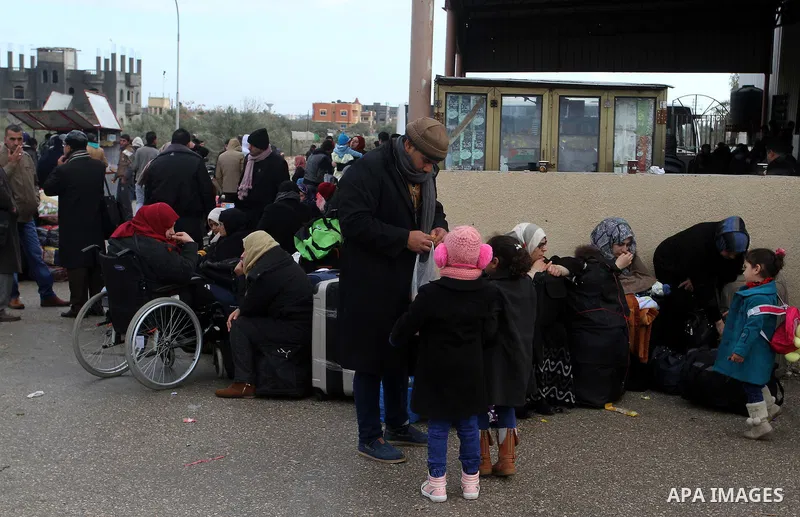 Palestinians wait for travel permits to cross into Egypt through the Rafah border crossing after it was opened by Egyptian authorities for humanitarian cases, in Rafah in the southern Gaza Strip, on January 29, 2017. Pho...