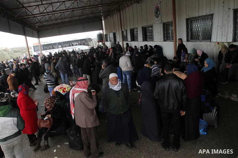Palestinians wait for travel permits to cross into Egypt through the Rafah border crossing after it was opened by Egyptian authorities for humanitarian cases, in Rafah in the southern Gaza Strip, on January 29, 2017. Pho...