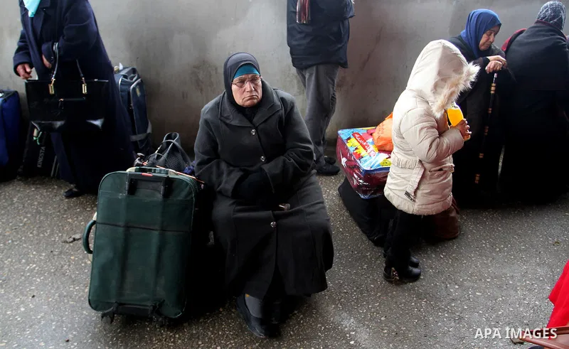 Palestinians wait for travel permits to cross into Egypt through the Rafah border crossing after it was opened by Egyptian authorities for humanitarian cases, in Rafah in the southern Gaza Strip, on January 29, 2017. Pho...