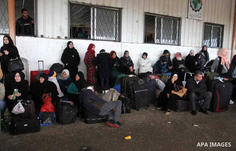Palestinians wait for travel permits to cross into Egypt through the Rafah border crossing after it was opened by Egyptian authorities for humanitarian cases, in Rafah in the southern Gaza Strip, on January 29, 2017. Pho...