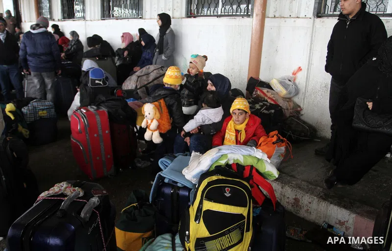Palestinians wait for travel permits to cross into Egypt through the Rafah border crossing after it was opened by Egyptian authorities for humanitarian cases, in Rafah in the southern Gaza Strip, on January 29, 2017. Pho...