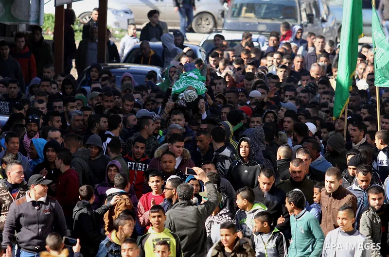Mourners carry the body of Palestinian Mohammed Abu Khalifa, during his funeral at the Jenin refugee camp, near the West Bank city of Jenin, on January 29, 2017. A Palestinian was shot dead and five others were wounded b...