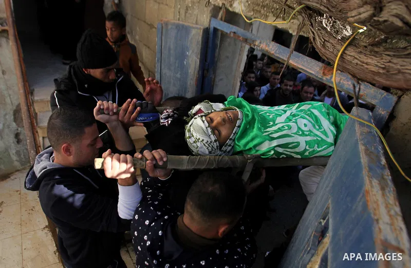 Mourners carry the body of Palestinian Mohammed Abu Khalifa, during his funeral at the Jenin refugee camp, near the West Bank city of Jenin, on January 29, 2017. A Palestinian was shot dead and five others were wounded b...