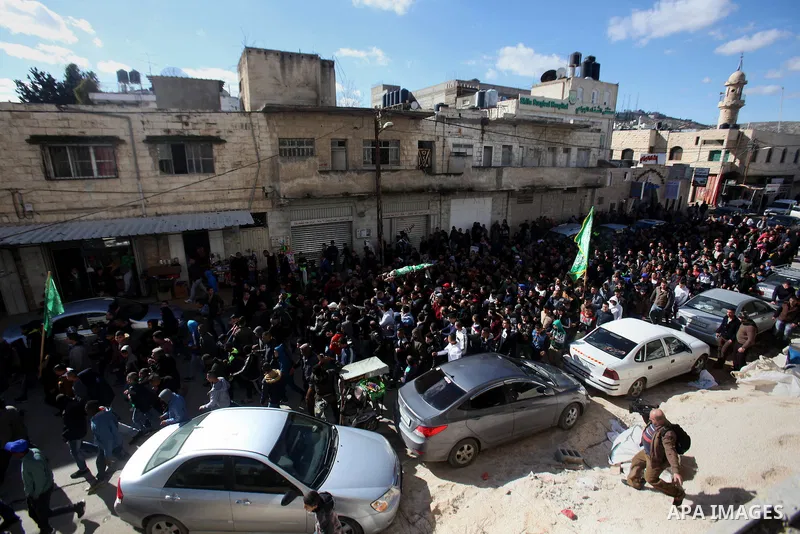 Mourners carry the body of Palestinian Mohammed Abu Khalifa, during his funeral at the Jenin refugee camp, near the West Bank city of Jenin, on January 29, 2017. A Palestinian was shot dead and five others were wounded b...