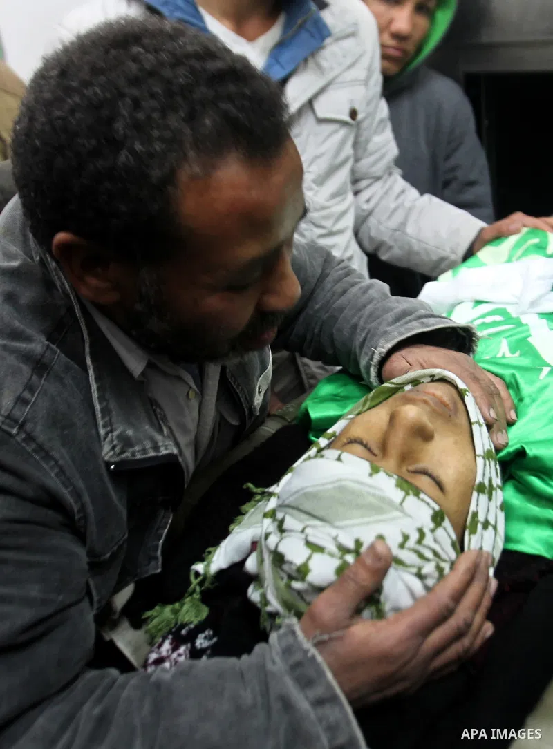 The father and relatives of Palestinian Mohammed Abu Khalifa mourn over his body, after he was shot dead by Israeli, at the local morgue prior to his funeral at the Jenin refugee camp, near the West Bank city of Jenin, o...