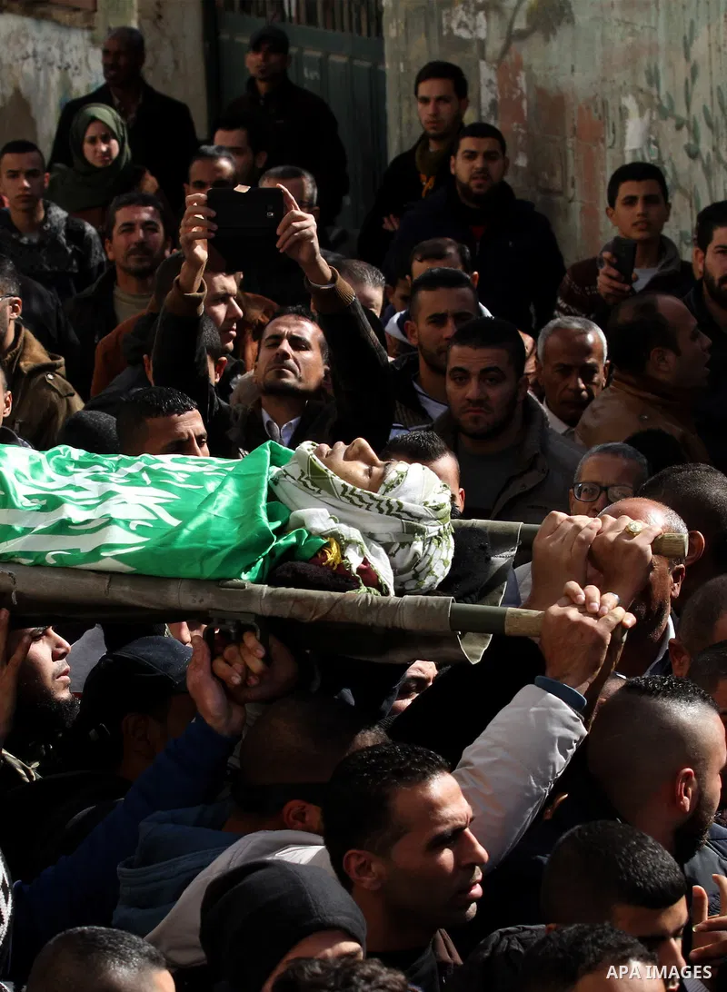 Mourners carry the body of Palestinian Mohammed Abu Khalifa, during his funeral at the Jenin refugee camp, near the West Bank city of Jenin, on January 29, 2017. A Palestinian was shot dead and five others were wounded b...