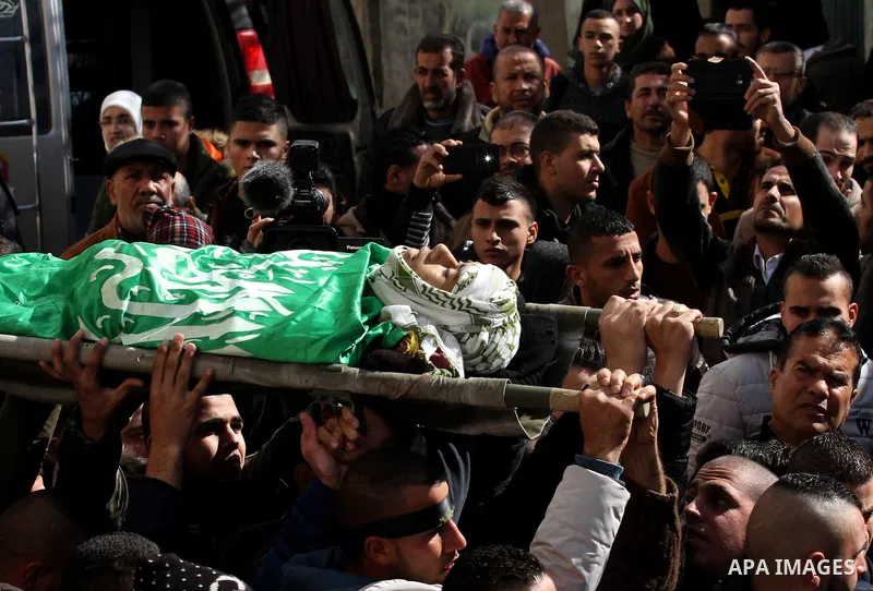 Mourners carry the body of Palestinian Mohammed Abu Khalifa, during his funeral at the Jenin refugee camp, near the West Bank city of Jenin, on January 29, 2017. A Palestinian was shot dead and five others were wounded b...