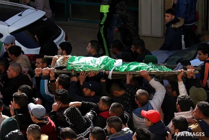 Mourners carry the body of Palestinian Mohammed Abu Khalifa, during his funeral at the Jenin refugee camp, near the West Bank city of Jenin, on January 29, 2017. A Palestinian was shot dead and five others were wounded b...