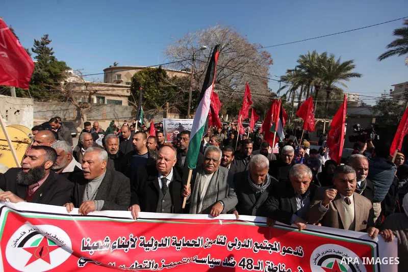 Palestinian supporters of the Democratic Front for the Liberation of Palestine (DFLP) take part during a protest to show solidarity with Palestinian in Bedouin village of Umm al-Hiran, in front of United Nation headquart...