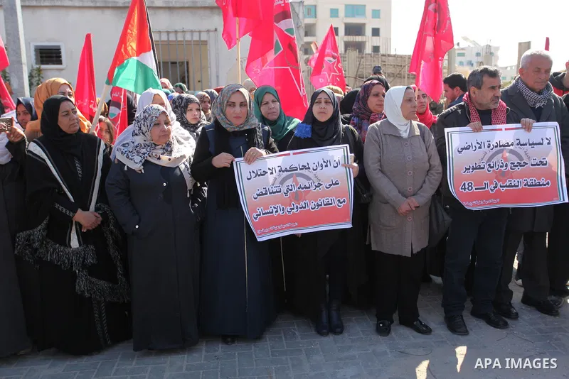 Palestinian supporters of the Democratic Front for the Liberation of Palestine (DFLP) take part during a protest to show solidarity with Palestinian in Bedouin village of Umm al-Hiran, in front of United Nation headquart...