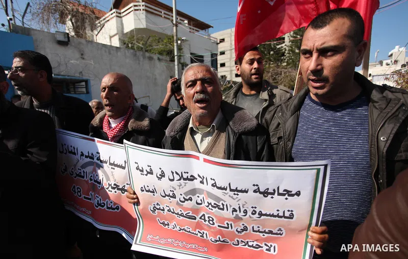 Palestinian supporters of the Democratic Front for the Liberation of Palestine (DFLP) take part during a protest to show solidarity with Palestinian in Bedouin village of Umm al-Hiran, in front of United Nation headquart...