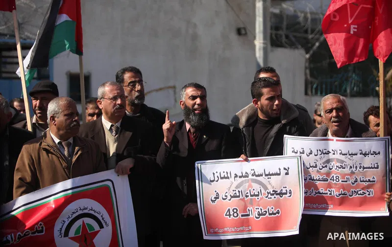 Palestinian supporters of the Democratic Front for the Liberation of Palestine (DFLP) take part during a protest to show solidarity with Palestinian in Bedouin village of Umm al-Hiran, in front of United Nation headquart...