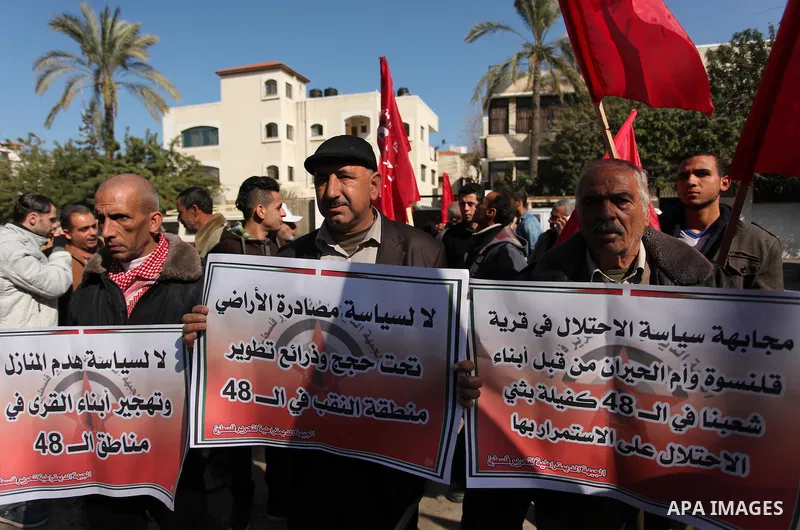 Palestinian supporters of the Democratic Front for the Liberation of Palestine (DFLP) take part during a protest to show solidarity with Palestinian in Bedouin village of Umm al-Hiran, in front of United Nation headquart...