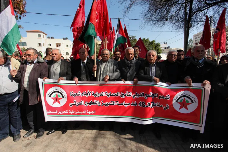 Palestinian supporters of the Democratic Front for the Liberation of Palestine (DFLP) take part during a protest to show solidarity with Palestinian in Bedouin village of Umm al-Hiran, in front of United Nation headquart...