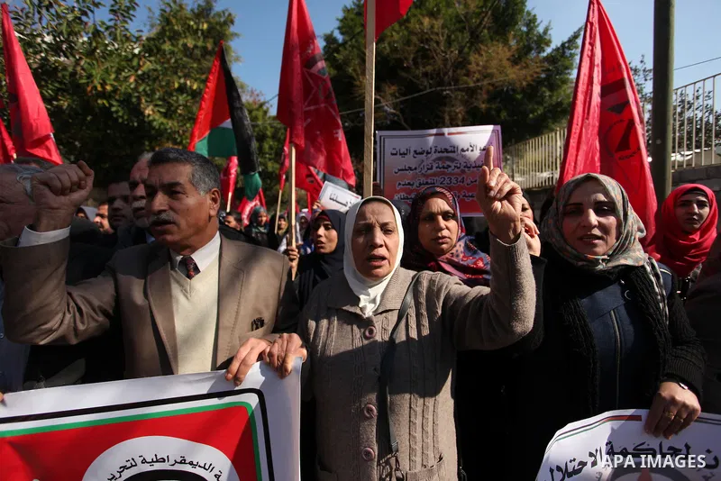 Palestinian supporters of the Democratic Front for the Liberation of Palestine (DFLP) take part during a protest to show solidarity with Palestinian in Bedouin village of Umm al-Hiran, in front of United Nation headquart...