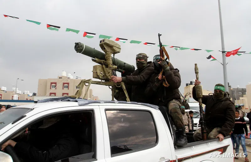 Members of the Ezzedine al-Qassam Brigades, the military wing of the Palestinian Islamist movement Hamas, attend a memorial in Rafah in the southern Gaza Strip on January 31, 2017, for Mohamed Zouari, a 49-year-old Tunis...