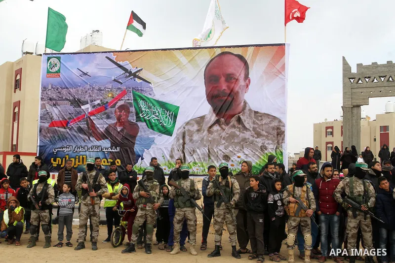 Members of the Ezzedine al-Qassam Brigades, the military wing of the Palestinian Islamist movement Hamas, attend a memorial in Rafah in the southern Gaza Strip on January 31, 2017, for Mohamed Zouari, a 49-year-old Tunis...