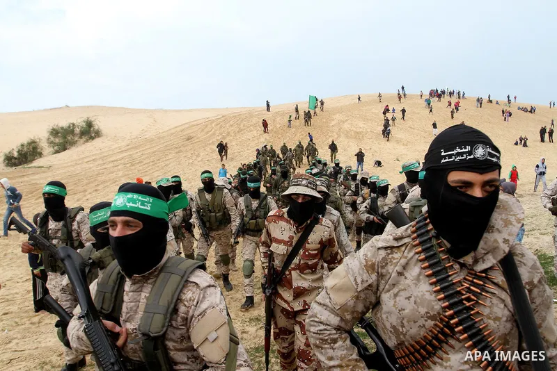 Members of the Ezzedine al-Qassam Brigades, the military wing of the Palestinian Islamist movement Hamas, attend a memorial in Rafah in the southern Gaza Strip on January 31, 2017, for Mohamed Zouari, a 49-year-old Tunis...