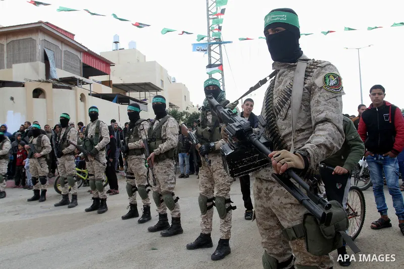 Members of the Ezzedine al-Qassam Brigades, the military wing of the Palestinian Islamist movement Hamas, attend a memorial in Rafah in the southern Gaza Strip on January 31, 2017, for Mohamed Zouari, a 49-year-old Tunis...