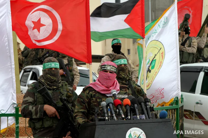 Abu Ubaida, spokesman of the Ezzedine al-Qassam Brigades, the military wing of the Palestinian Islamist movement Hamas, speaks during a memorial in Rafah in the southern Gaza Strip on January 31, 2017, for Mohamed Zouari...