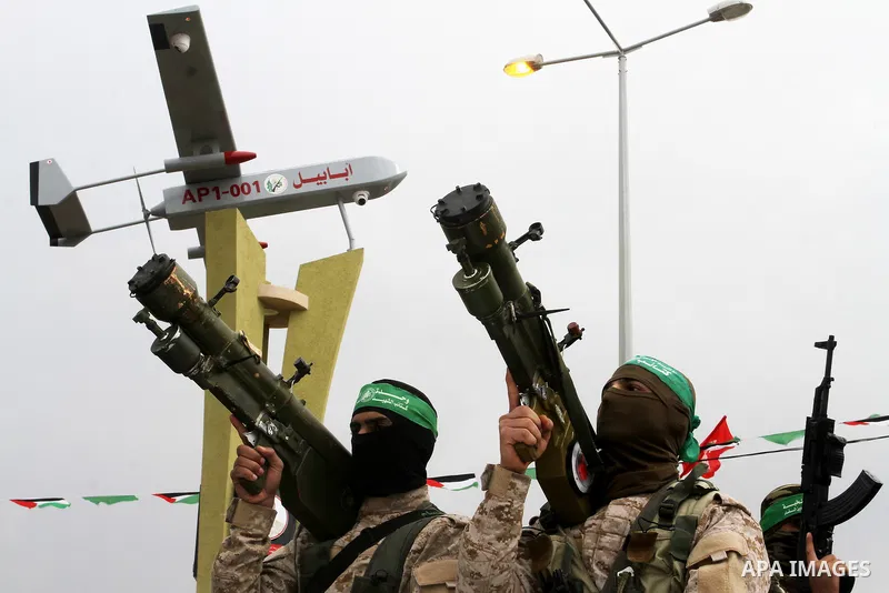 Members of the Ezzedine al-Qassam Brigades, the military wing of the Palestinian Islamist movement Hamas, attend a memorial in Rafah in the southern Gaza Strip on January 31, 2017, for Mohamed Zouari, a 49-year-old Tunis...