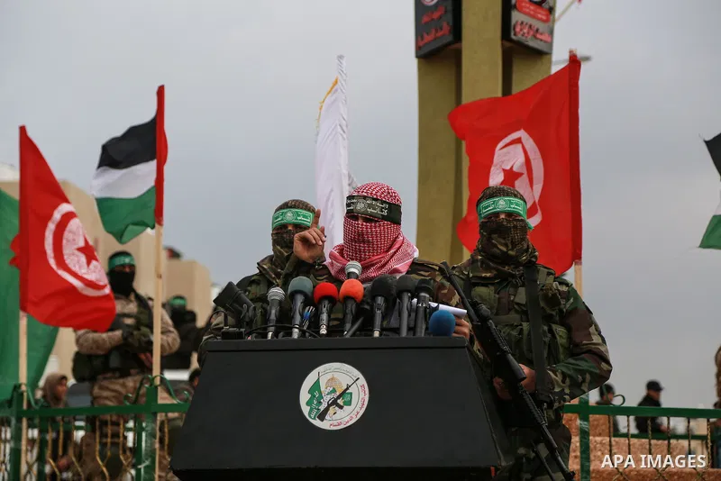 Abu Ubaida, spokesman of the Ezzedine al-Qassam Brigades, the military wing of the Palestinian Islamist movement Hamas, speaks during a memorial in Rafah in the southern Gaza Strip on January 31, 2017, for Mohamed Zouari...