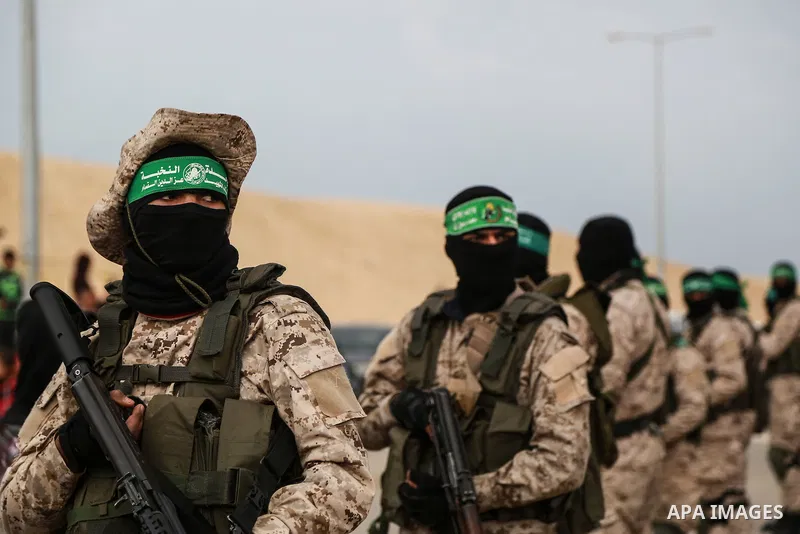 Members of the Ezzedine al-Qassam Brigades, the military wing of the Palestinian Islamist movement Hamas, attend a memorial in Rafah in the southern Gaza Strip on January 31, 2017, for Mohamed Zouari, a 49-year-old Tunis...