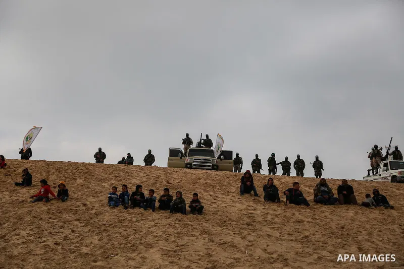 Members of the Ezzedine al-Qassam Brigades, the military wing of the Palestinian Islamist movement Hamas, attend a memorial in Rafah in the southern Gaza Strip on January 31, 2017, for Mohamed Zouari, a 49-year-old Tunis...