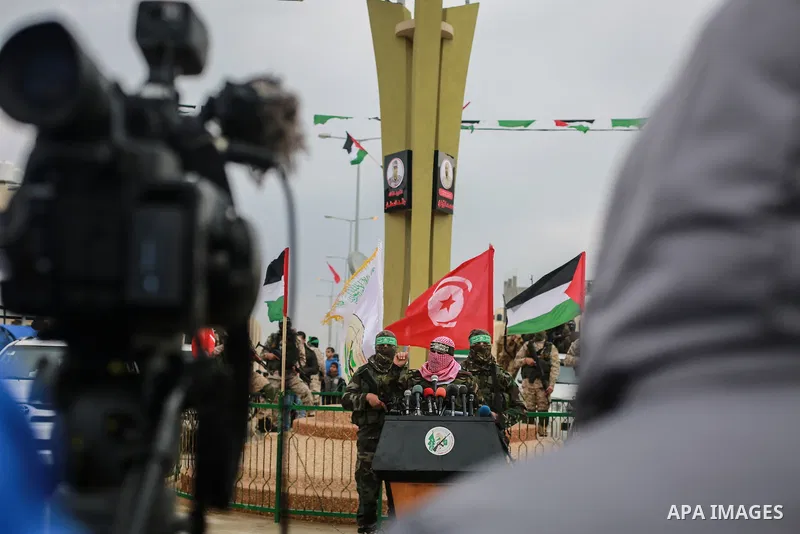 Abu Ubaida, spokesman of the Ezzedine al-Qassam Brigades, the military wing of the Palestinian Islamist movement Hamas, speaks during a memorial in Rafah in the southern Gaza Strip on January 31, 2017, for Mohamed Zouari...
