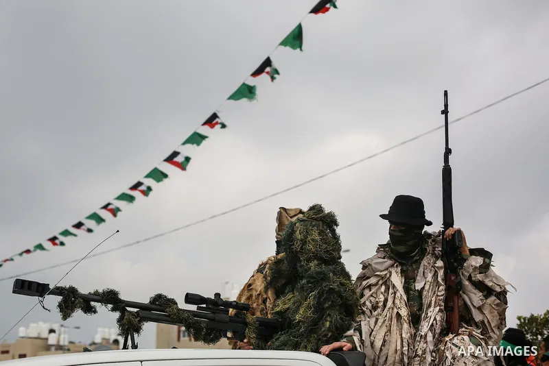 Members of the Ezzedine al-Qassam Brigades, the military wing of the Palestinian Islamist movement Hamas, attend a memorial in Rafah in the southern Gaza Strip on January 31, 2017, for Mohamed Zouari, a 49-year-old Tunis...