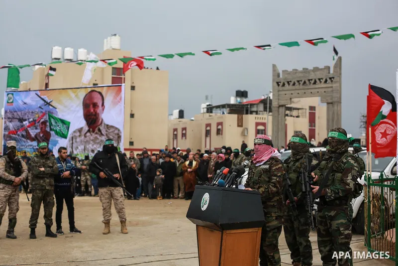 Abu Ubaida, spokesman of the Ezzedine al-Qassam Brigades, the military wing of the Palestinian Islamist movement Hamas, speaks during a memorial in Rafah in the southern Gaza Strip on January 31, 2017, for Mohamed Zouari...